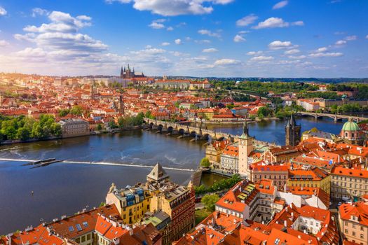 Prague scenic spring aerial view of the Prague Old Town pier architecture Charles Bridge over Vltava river in Prague, Czechia. Old Town of Prague with the Castle in the background, Czech Republic.
