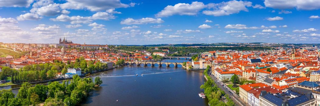 Prague scenic spring aerial view of the Prague Old Town pier architecture Charles Bridge over Vltava river in Prague, Czechia. Old Town of Prague with the Castle in the background, Czech Republic.