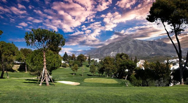 golf course and green  in Marbella, Spain, at sunset