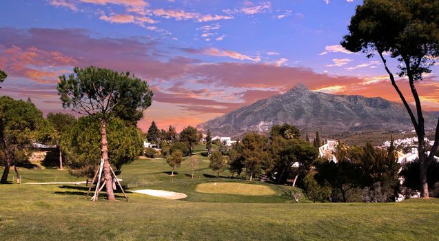 golf course and green  in Marbella, Spain, at sunset