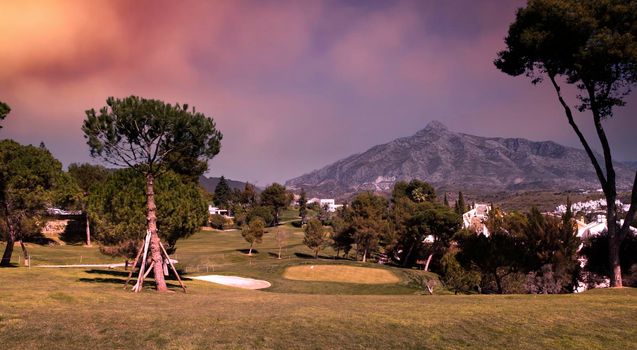 golf course and green  in Marbella, Spain, at sunset