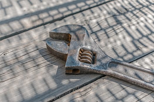 Old and rusty chrome vanadium monkey wrench, close up