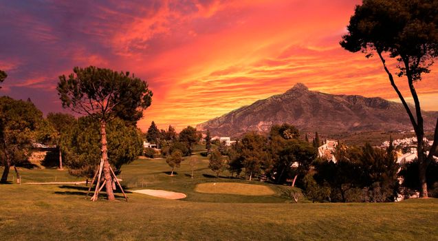 golf course and green  in Marbella, Spain, at sunset