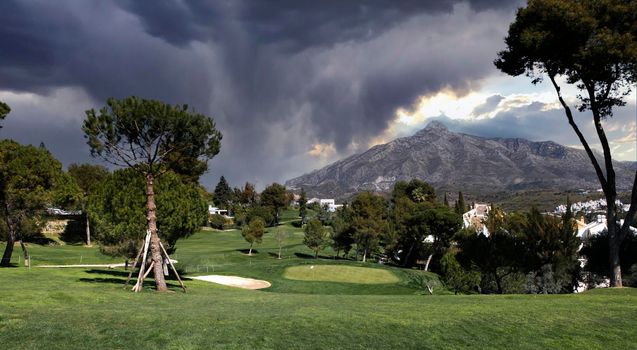 golf course and green  in Marbella, Spain, at sunset