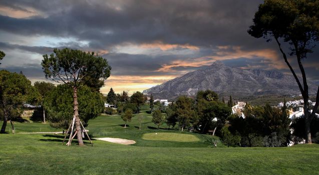 golf course and green  in Marbella, Spain, at sunset