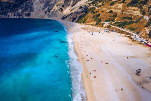 Aerial drone view of iconic turquoise and sapphire bay and beach of Myrtos, Kefalonia (Cephalonia) island, Ionian, Greece. Myrtos beach, Kefalonia island, Greece. Beautiful view of Myrtos beach.