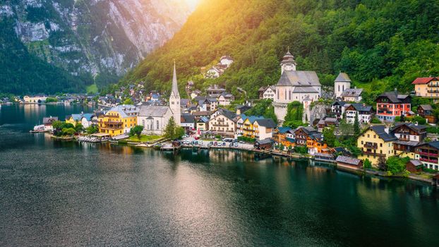 Aerial view of austrian mountain village Hallstatt and Hallstatter lake. Beautiful summer time. Salzkammergut, Austria. Hallstatt village over Hallstatter See, in Salzkammergut, Austria.