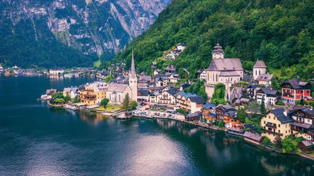 Aerial view of austrian mountain village Hallstatt and Hallstatter lake. Beautiful summer time. Salzkammergut, Austria. Hallstatt village over Hallstatter See, in Salzkammergut, Austria.