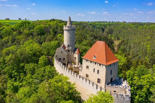 Aerial view of medieval castle Kokorin nearby Prague in Czechia. Central Europe. Medieval gothic castle Kokorin, Kokorinsko protected landscape area in Czech Republic. Medieval gothic castle Kokorin.