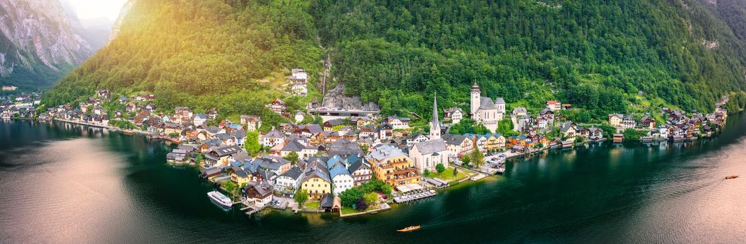 Aerial view of austrian mountain village Hallstatt and Hallstatter lake. Beautiful summer time. Salzkammergut, Austria. Hallstatt village over Hallstatter See, in Salzkammergut, Austria.