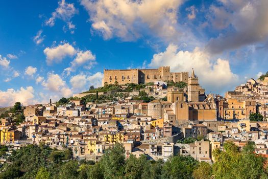 Caccamo, Sicily. Medieval Italian city with the Norman Castle in Sicily mountains, Italy. View of Caccamo town on the hill with mountains in the background, Sicily, Italy.