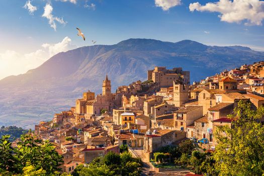 Caccamo, Sicily. Medieval Italian city with the Norman Castle in Sicily mountains, Italy. View of Caccamo town on the hill with mountains in the background, Sicily, Italy.