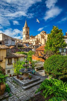 Picturesque street with the Duomo in the background in Novara di Sicilia, Sicily, Italy. Amazing cityscape of Novara di Sicilia town. Mountain village Novara di Sicilia, Sicily, Italy.