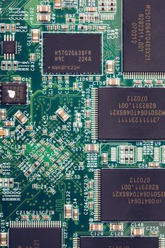 Electronic circuit board close up. Electronic computer hardware technology. Motherboard digital chip. Tech science background. Integrated communication processor. Information engineering component.