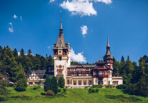 Peles Castle, Romania. Beautiful famous royal castle and ornamental garden in Sinaia landmark of Carpathian Mountains in Europe