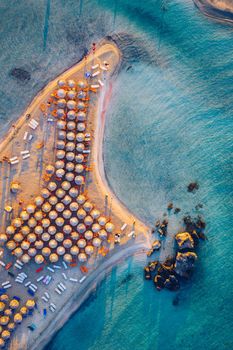 Aerial drone shot of beautiful turquoise beach with pink sand Elafonissi, Crete, Greece. Best beaches of Mediterranean, Elafonissi beach, Crete, Greece. Famous Elafonisi beach on Greece island, Crete.