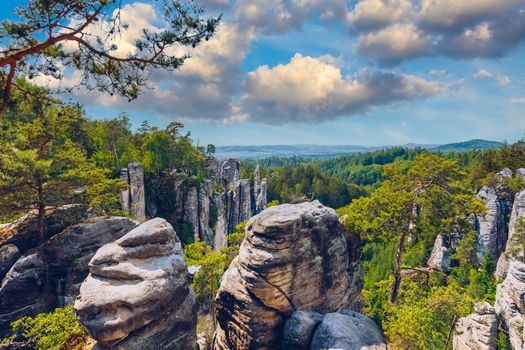 Prachov rocks (Prachovske skaly) in Cesky Raj region, Czech Republic. Sandstone rock formation in vibrant forest. Prachov Rocks, Czech: Prachovske skaly, in Bohemian Paradise, Czech Republic.