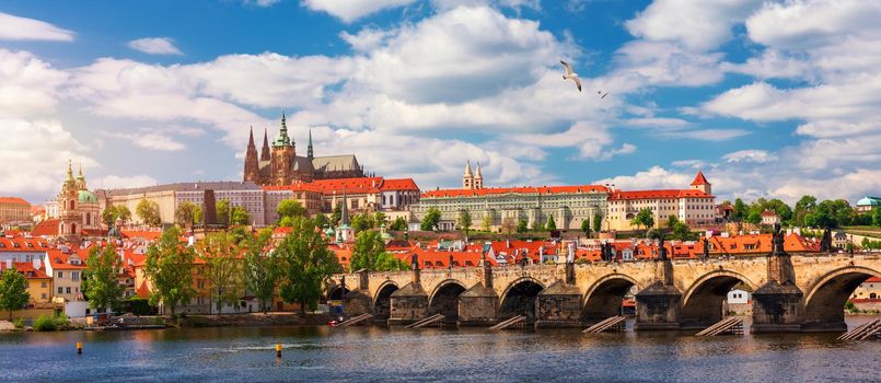 Prague scenic spring view of the Prague Old Town pier architecture Charles Bridge over Vltava river in Prague, Czechia. Old Town of Prague with the Castle in the background, Czech Republic.