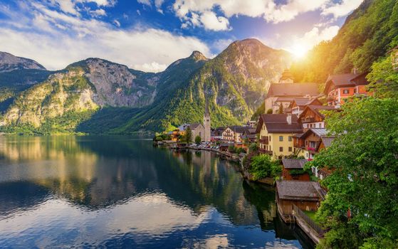 Scenic picture-postcard view of famous Hallstatt mountain village in the Austrian Alps, Salzkammergut region, Hallstatt, Austria. Hallstatt village on Hallstatter lake in Austrian Alps.
