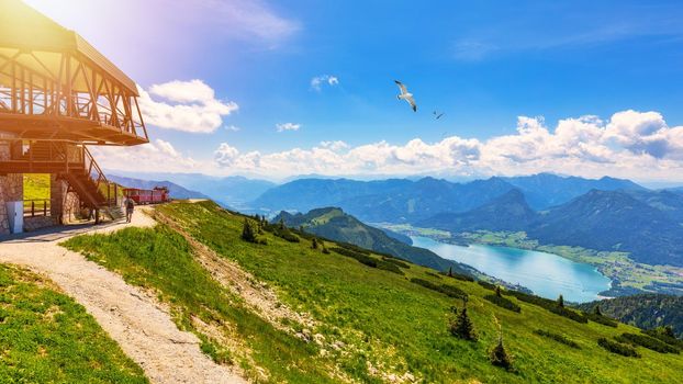 Schafbergbahn mountain train, Schafberg mountain, Salzkammergut region, Salzburg Land state, Austria. Journey to the top of Alps through lush fields and green forests.View of lake Wolfgangsee.