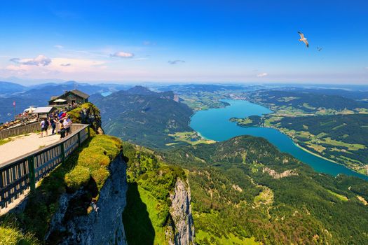 Amazing view from Schafberg by St. Sankt Wolfgang im in Salzkammergut, Haus house Schafbergspitze, lake Mondsee, Moonlake. Blue sky, alps mountains. Upper Austria, Salzburg, near Wolfgangsee, Attersee