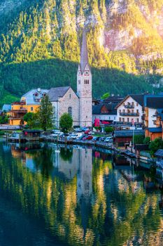 View of famous Hallstatt mountain village in the Austrian Alps at beautiful light in summer, Salzkammergut region, Hallstatt, Austria. Hallstatt village on Hallstatter lake in Austrian Alps.