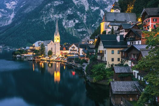 View of famous Hallstatt mountain village in the Austrian Alps at beautiful light in summer, Salzkammergut region, Hallstatt, Austria. Hallstatt village on Hallstatter lake in Austrian Alps.