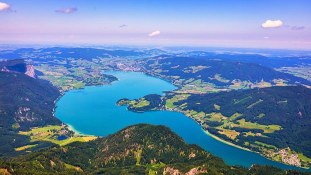 Amazing view from Schafberg by St. Sankt Wolfgang im in Salzkammergut, Haus house Schafbergspitze, lake Mondsee, Moonlake. Blue sky, alps mountains. Upper Austria, Salzburg, near Wolfgangsee, Attersee