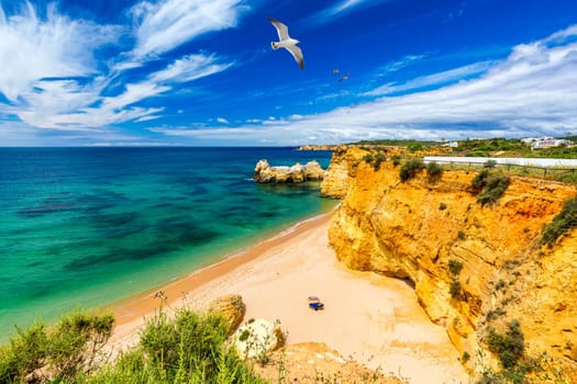 Praia dos Tres Castelos in south Portugal, Portimao, Algarve region. Landscape with Atlantic Ocean, shore and rocks in Tres Castelos beach (Praia dos Tres Castelos), Algarve, Portimao, Portugal.