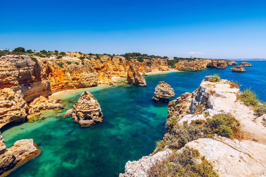 Praia da Marinha, beautiful beach Marinha in Algarve, Portugal. Navy Beach (Praia da Marinha), one of the most famous beaches of Portugal, located on the Atlantic coast in Lagoa Municipality, Algarve.