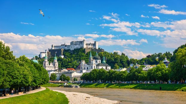 Panoramic view of Salzburg skyline with Fortress Hohensalzburg and river Salzach, Salzburger Land, Austria. Salzburg skyline with river Salzach in springtime, Austria.