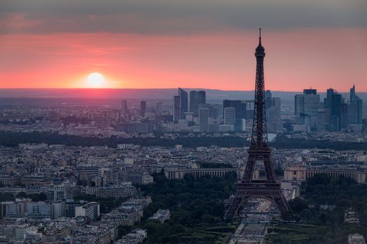 View of Paris with Eiffel Tower from Montparnasse building. Eiffel tower view from Montparnasse at sunset, view of the Eiffel Tower and La Defense district in Paris, France.