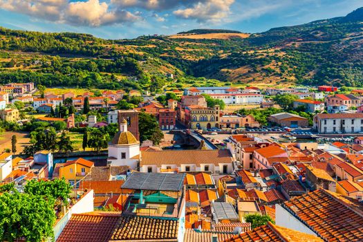 Aerial view of the beautiful village of Bosa with colored houses and a medieval castle. Bosa is located in the north-wesh of Sardinia, Italy. Aerial view of colorful houses in Bosa village, Sardegna.