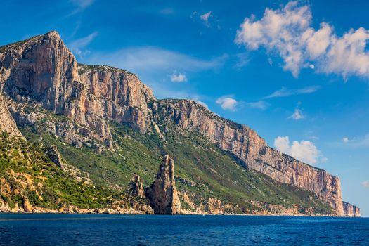 The monolith of Pedra Longa, Baunei, province of Ogliastra, East Sardinia, Italy. The rocky spire which rises majestically out of the sea. Holidays in Sardinia, Italy.