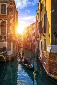 Canal with gondolas in Venice, Italy. Architecture and landmarks of Venice. Venice postcard with Venice gondolas.