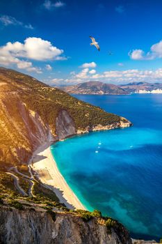 Aerial drone view of iconic turquoise and sapphire bay and beach of Myrtos, Kefalonia (Cephalonia) island, Ionian, Greece. Myrtos beach, Kefalonia island, Greece. Beautiful view of Myrtos beach.