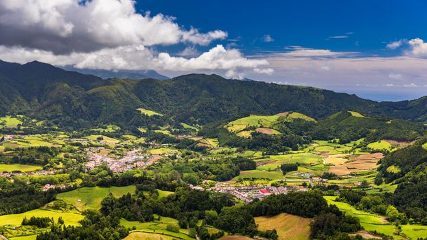 Aerial view of Lagoa das Furnas located on the Azorean island of Sao Miguel, Azores, Portugal. Lake Furnas (Lagoa das Furnas) on Sao Miguel, Azores, Portugal from the Pico do Ferro scenic viewpoint.