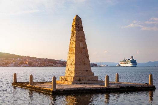 View of the De Bosset Bridge in Argostoli city on Kefalonia island. De Bosset Bridge on lakeside In Argostoli, Kefalonia. Obelisk and the de Bosset bridge in Argostoli, Kefalonia, Greece