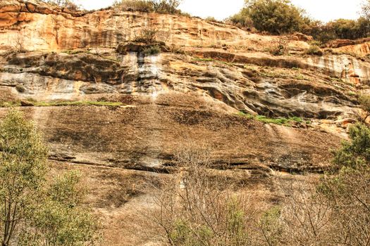 Mountain wall with colorful streaks in the Sierra of Alcaraz, Castile-la Mancha community, Spain