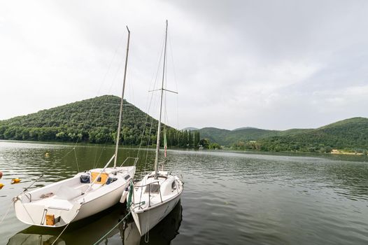 piediluco,italy june 23 2021:piediluco lake with boats by the lake