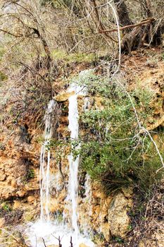 Waterfall in leafy forest in Spain in Spring