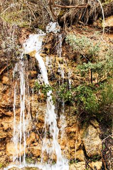 Waterfall in leafy forest in Spain in Spring