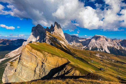 View on Seceda peak. Trentino Alto Adige, Dolomites Alps, South Tyrol, Italy. Odle mountain range, Val Gardena. Majestic Furchetta peak. Odles group seen from Seceda, Santa Cristina Val Gardena.