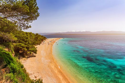 Zlatni Rat (Golden Cape or Golden Horn) famous turquoise beach in Bol town on Brac island, Dalmatia, Croatia. Zlatni Rat sandy beach at Bol on Brac island of Croatia in summertime.