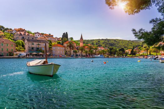 Fishing boats in Splitska village with beautiful port, Brac island, Croatia. Village of Splitska on Brac island seafront view, Dalmatia, Croatia, Croatia.