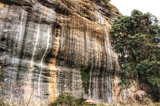 Mountain wall with colorful streaks in the Sierra of Alcaraz, Castile-la Mancha community, Spain