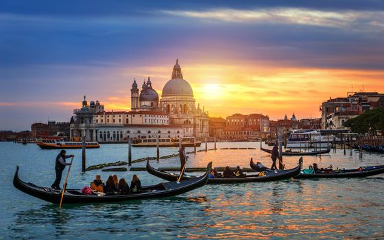 Canal with gondolas in Venice, Italy. Architecture and landmarks of Venice. Venice postcard with Venice gondolas.