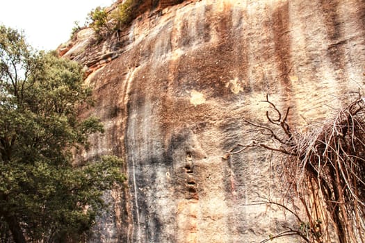 Mountain wall with colorful streaks in the Sierra of Alcaraz, Castile-la Mancha community, Spain