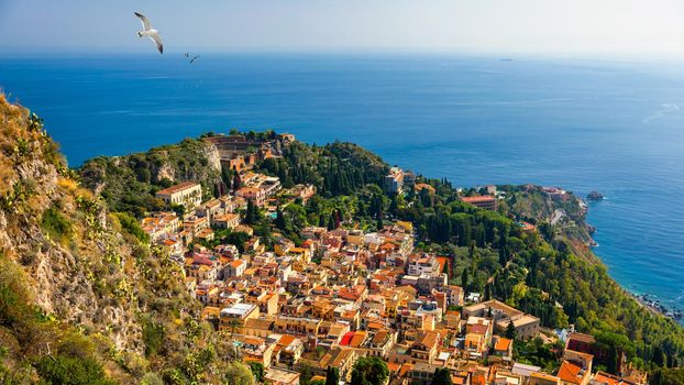 Ruins of Ancient Greek theater in Taormina, Sicily, Italy. Taormina located in Metropolitan City of Messina, on east coast of island of Sicily. 