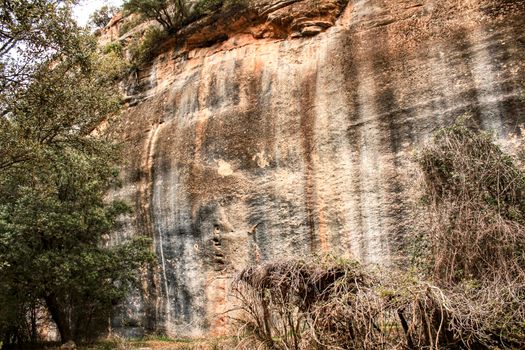 Mountain wall with colorful streaks in the Sierra of Alcaraz, Castile-la Mancha community, Spain